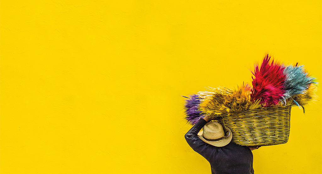 person-standing-in-front-of-a-yellow-wall