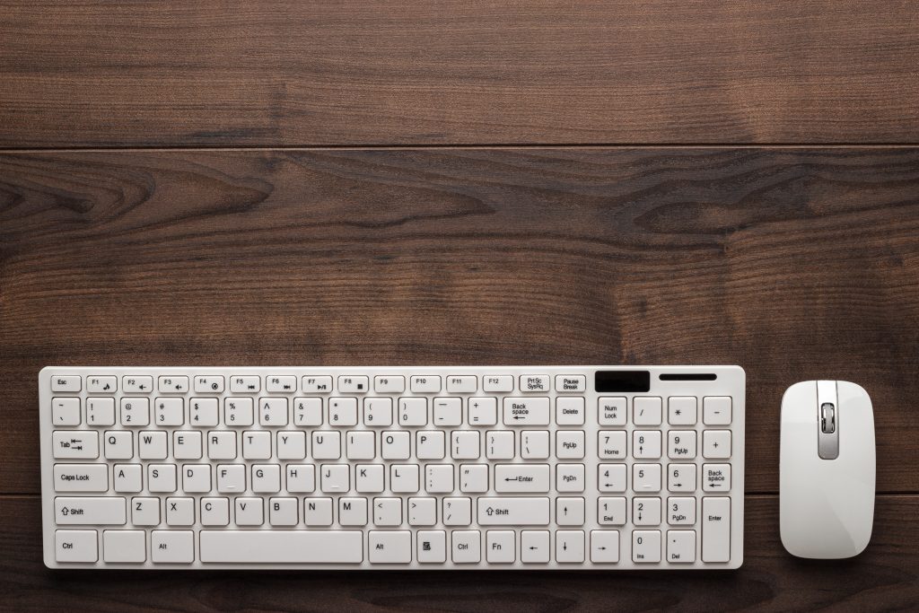 view from above on the office table with computer keyboard and mouse