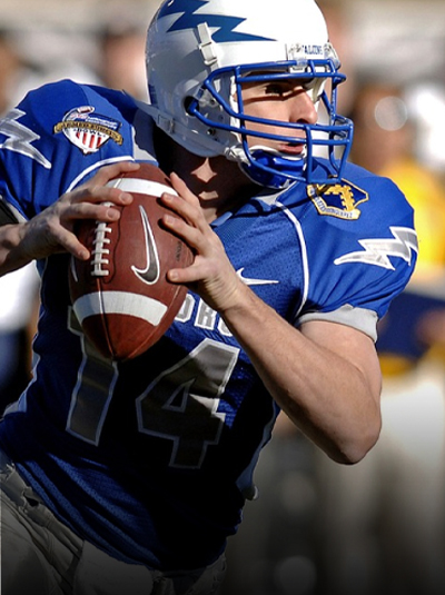 American football player preparing to throw a football